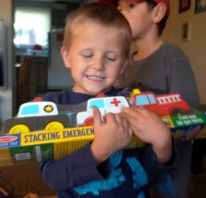 [Name] Sumner reacts to receiving sensory toys.