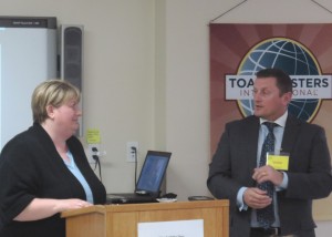 Crysta Trask and Denis Falconer address the Toastmasters group.