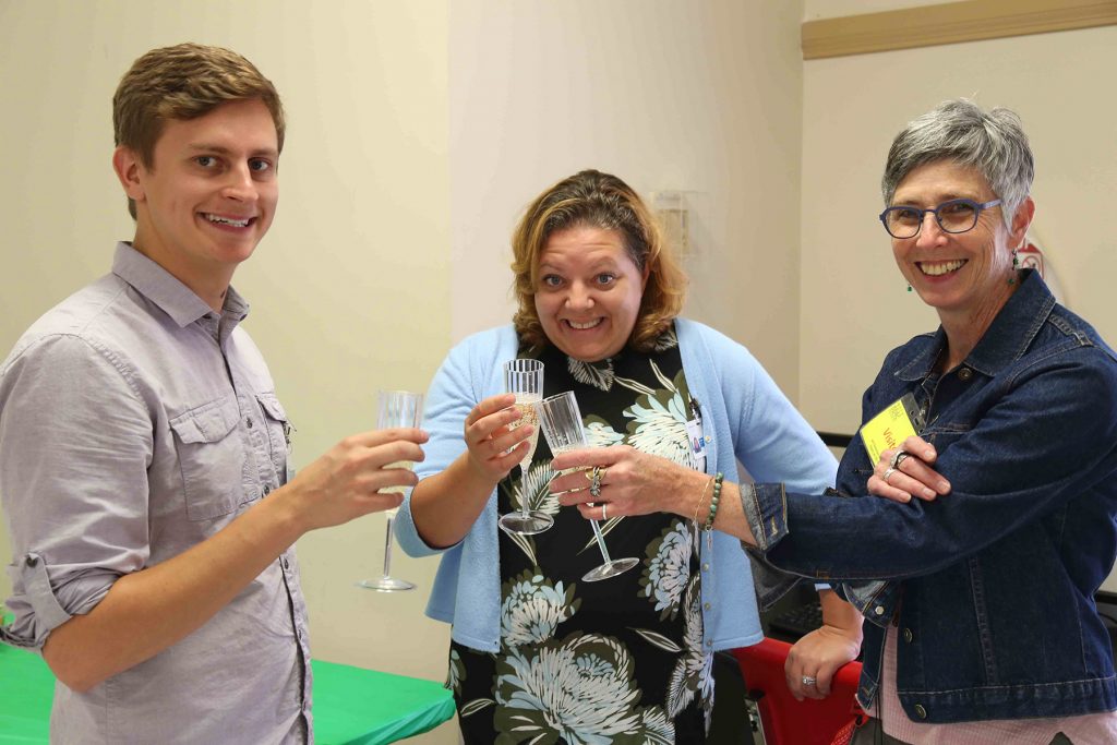 DDRC facilitators Ryan and Andrea, and BVC's Bernice Gowan celebrate the launch with sparkling juice.
