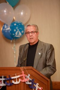 Tom Shindruk of the Developmental Disabilities Resource Foundation board addresses the audience.