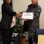 Hannah Y. receives her certificate.