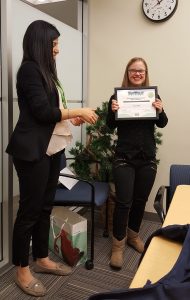 Morgan G. receives her certificate.